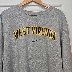 Brand New never worn WVU crew neck Nike sweat shirt.